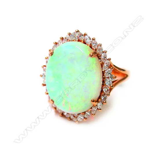 An impressive large 18ct. rose gold opal and diamond ring