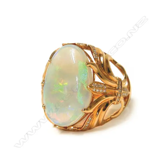 An impressive modern 18ct. rose gold large opal and diamond dress ring