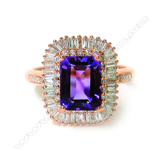 A modern 18ct. rose gold amethyst and diamond dress ring