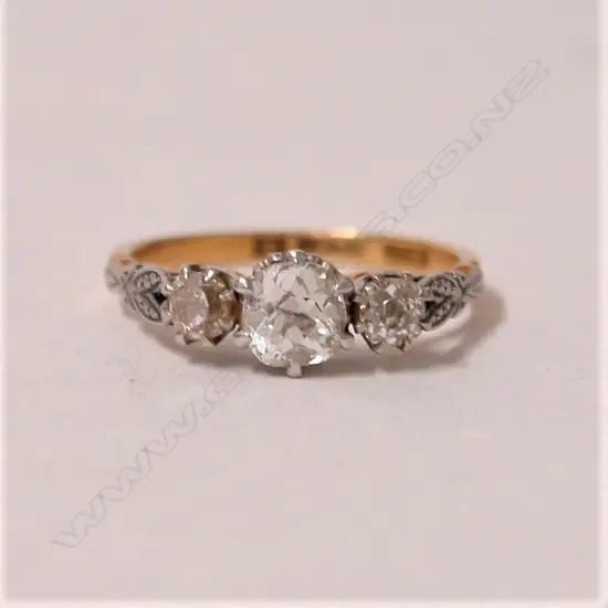 A lady's estate 18ct. yellow and white gold three stone diamond ring