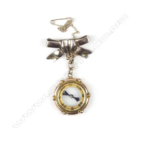 An Edwardian 9ct. gold compass charm