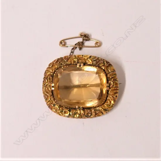 A 19thC large citrine set fancy gold framed brooch