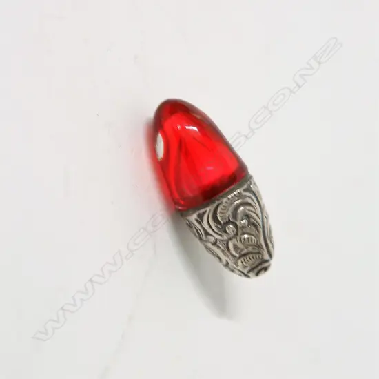 A late Victorian silver and cranberry and glass egg-form scent bottle