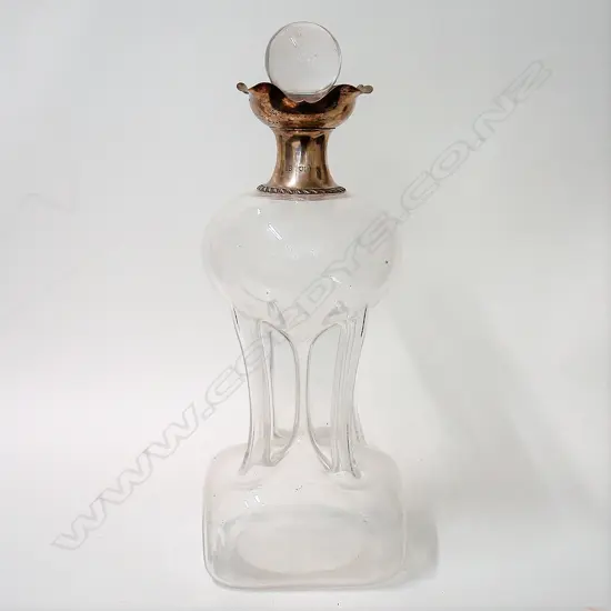 A large and impressive Edwardian glass and silver mounted 'glug-glug' decanter