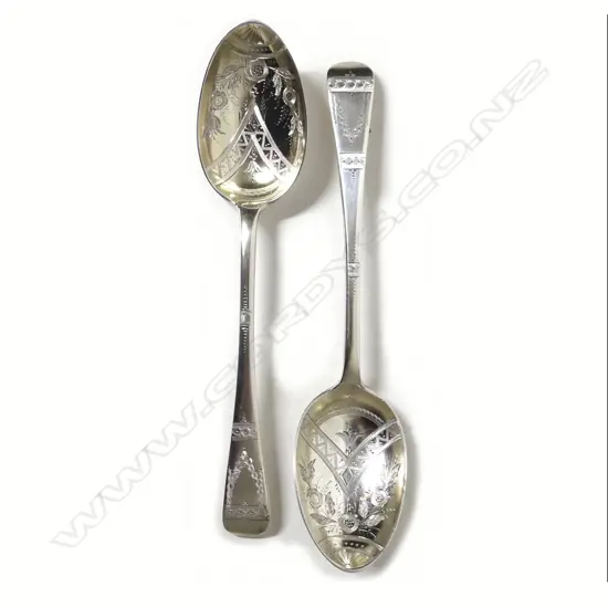 A pair of silver dessert spoons