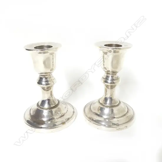 A small pair of sterling silver baluster column candlesticks