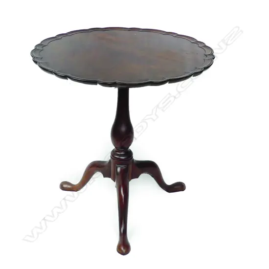A quality George III flame mahogany tilt-top wine table