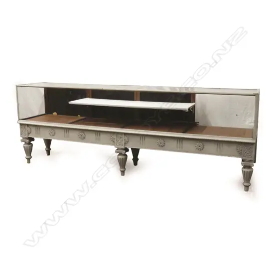 A large long old off-white paint finish shop counter display cabinet