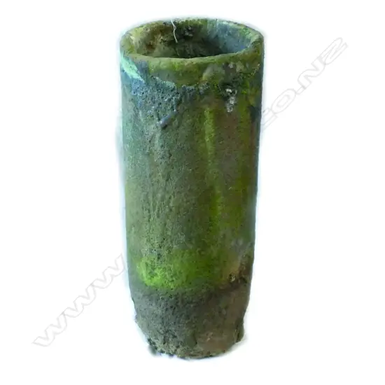 A large old furnace crucible