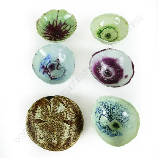 Five small press moulded porcelain dishes