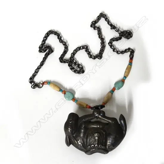 A Tibetan silver donkey pendant