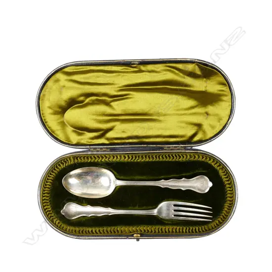 An Edwardian silver cased spoon and fork