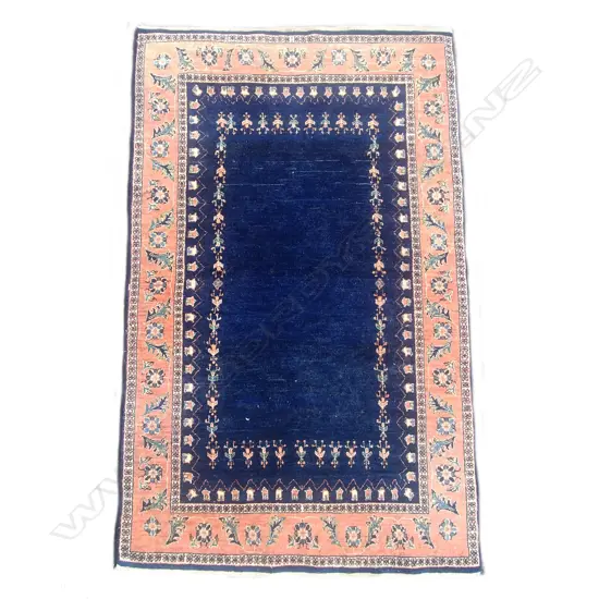 A hand knotted Persian rug