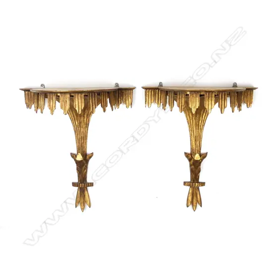 A pair of gilded wall sconces