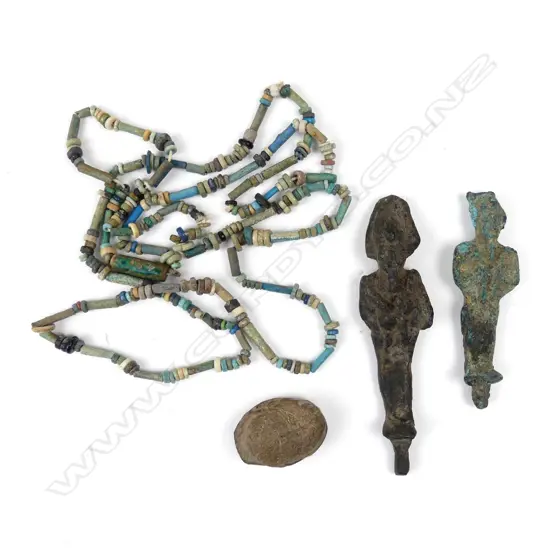 A collection of four old Egyptian artefacts