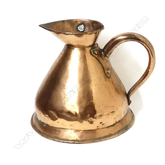 A copper one gallon measuring jug