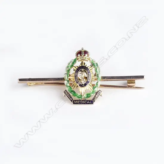 A 9ct gold and enamel brooch