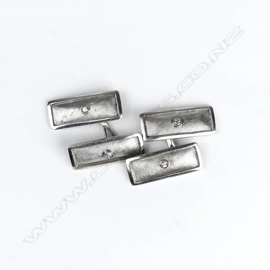 A pair of vintage 18ct. white gold and diamond set cufflinks