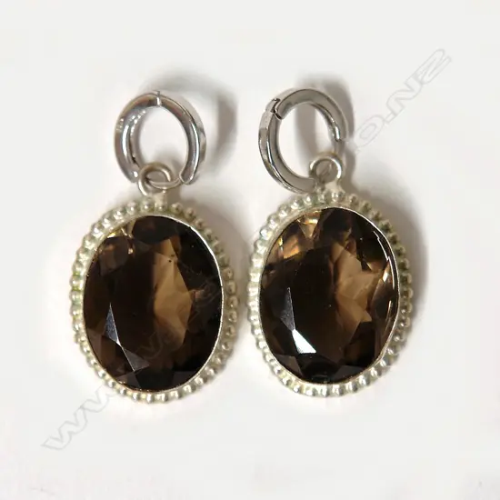 A pair of large topaz and silver earrings