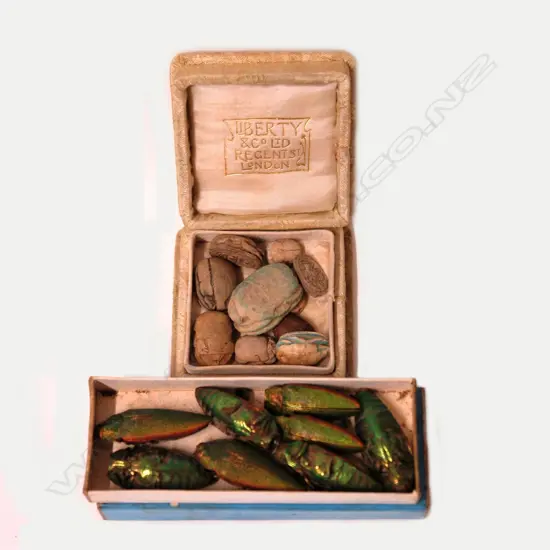 A collection of vintage Egyptian glazed clay scarab beetles and eight real scarab beetles