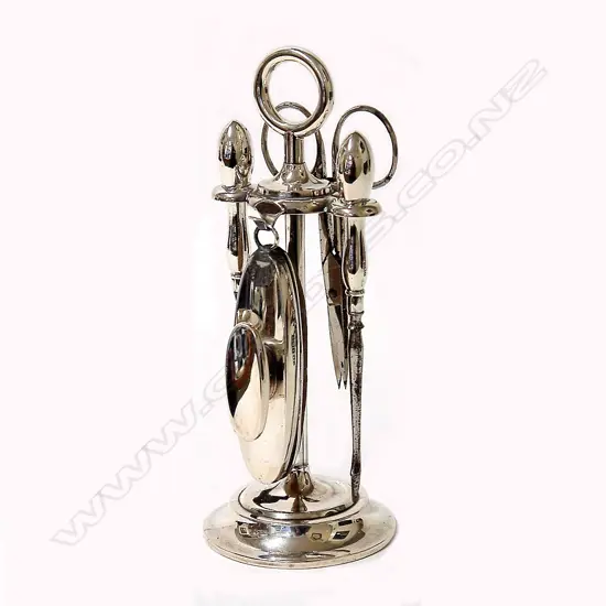 A 1920s silver vanity set on stand