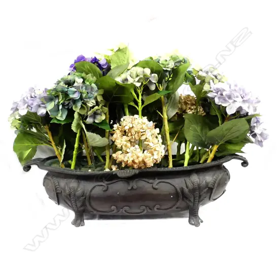 A cast iron French style plant trough