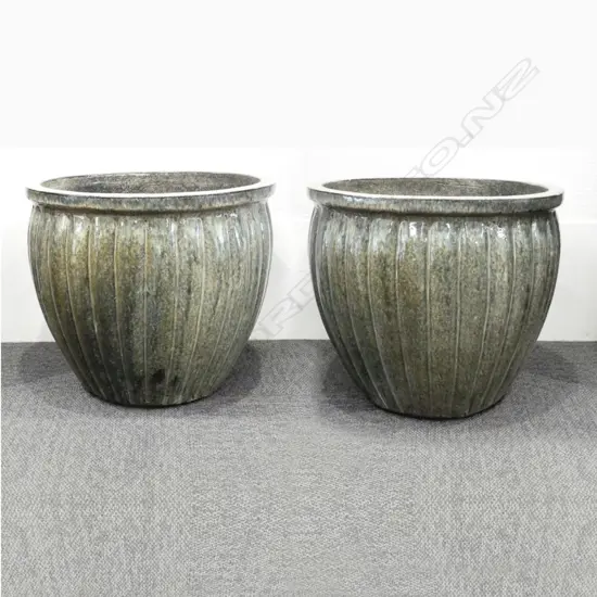 A pair of large ribbed green garden planters