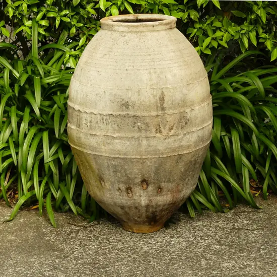 An old Turkish terracotta tall storage jar