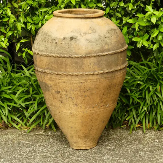 An old Turkish terracotta tall storage jar