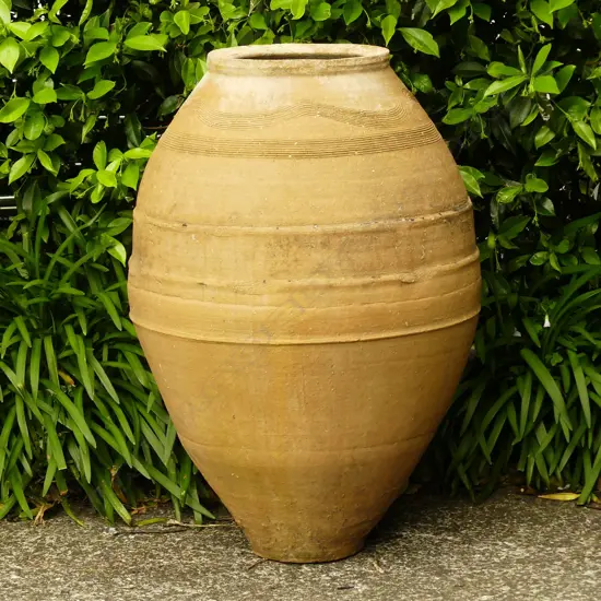 An old Turkish terracotta tall storage jar