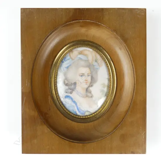A hand painted portrait miniature on ivory