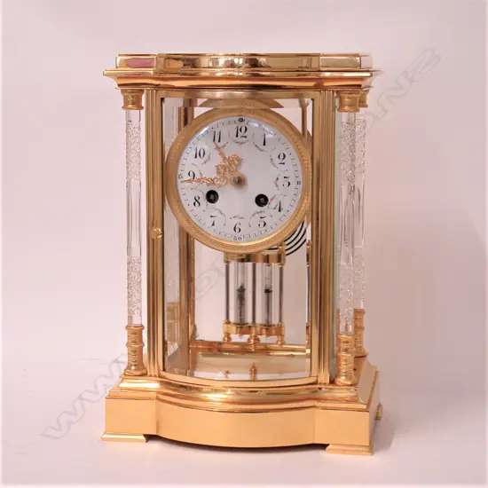 A quality mid-20thC French gilt brass four-glass type mantel clock