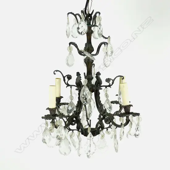 A vintage gilt metal and crystal chandelier in the French style