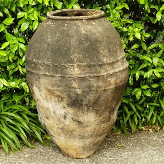 An old Turkish terracotta tall storage jar