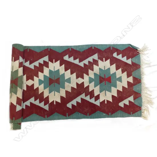 A hand woven Turkish kilim runner with bold geometric designs
