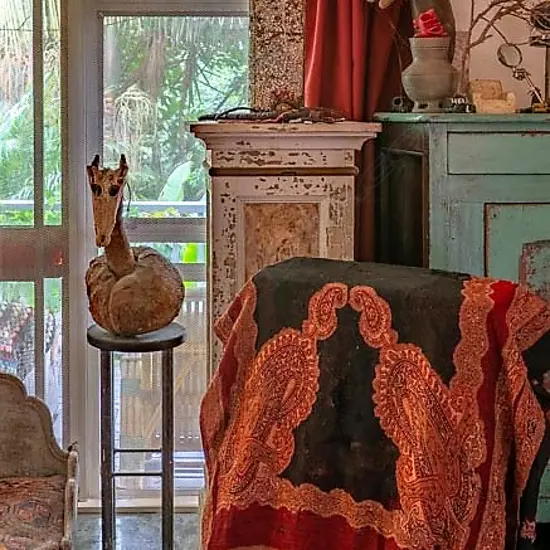 A tall colonial style plinth cupboard