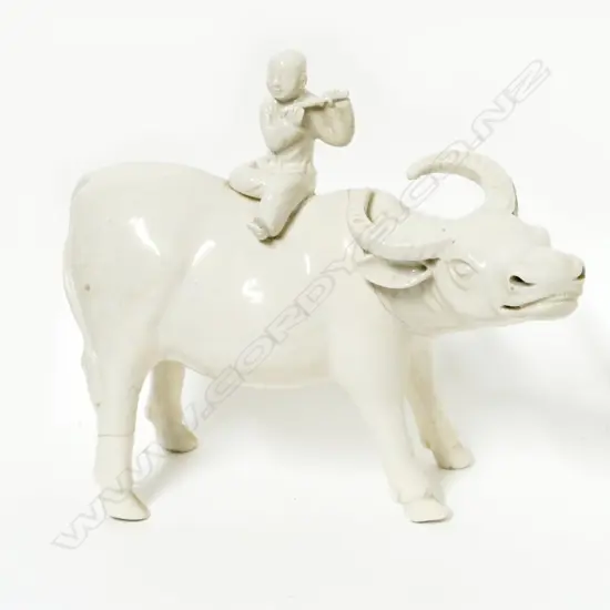 An old blanc-de-chine figure of an ox and boy