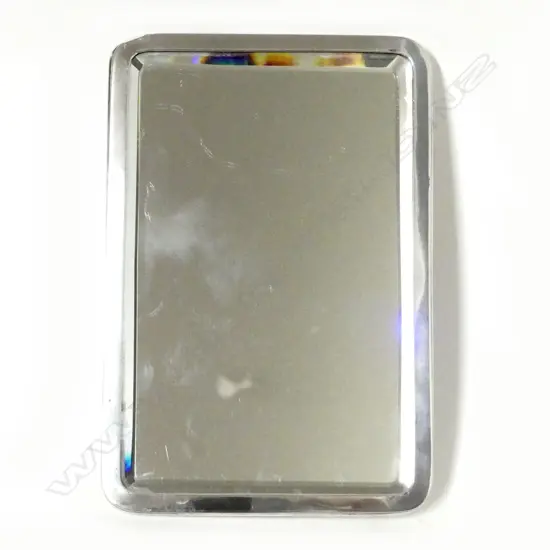 A silver framed easel backed vanity mirror