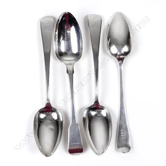 Four silver serving spoons