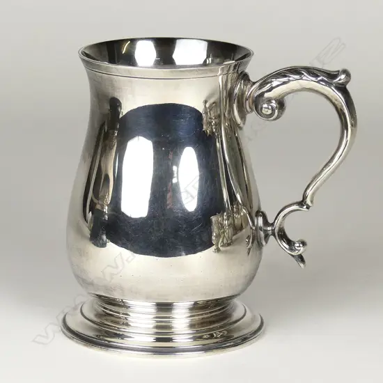 A silver pint mug