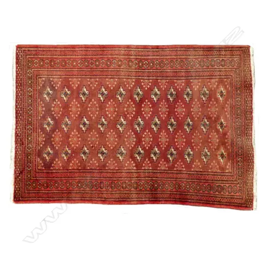 A small Persian hand knotted rug