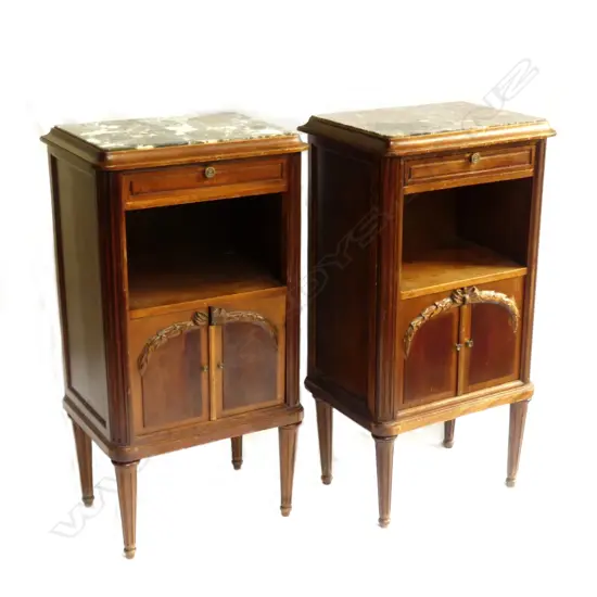 A pair of French mahogany marble top bedside cabinets