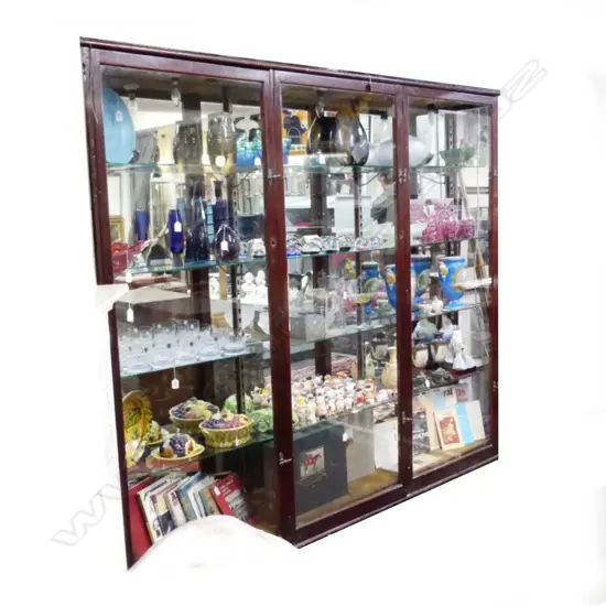 A vintage wood and glass display cabinet