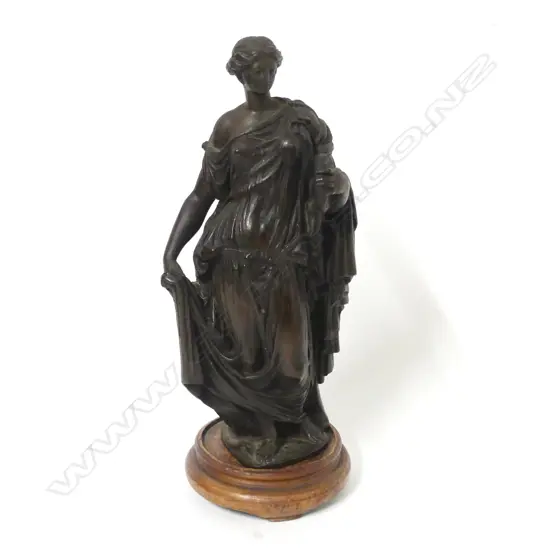 A small bronze statuette of a woman representing Victory