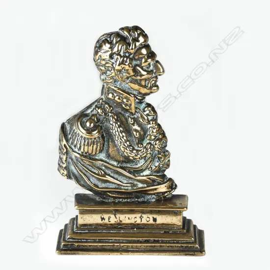 A Victorian brass doorstop