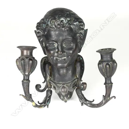 A Victorian bronze wall candle sconce