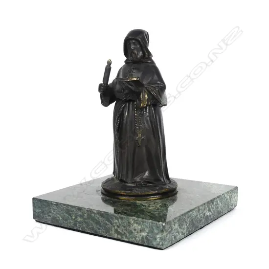 A bronze box modelled as a monk