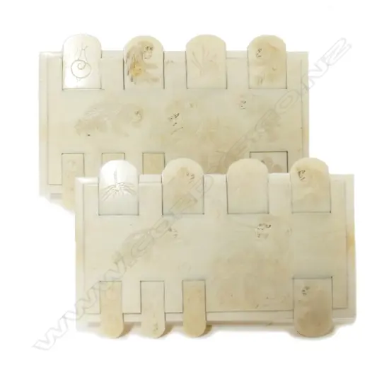 A pair of Japanese ivory whist counters