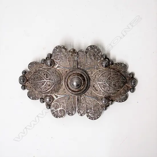 A vintage filigree silver elaborate two-piece buckle