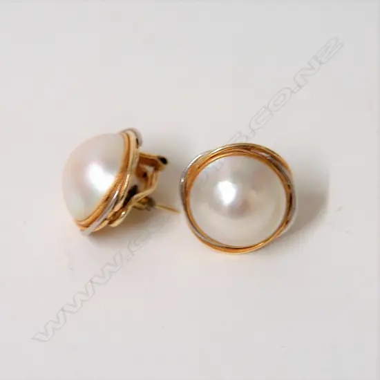 A pair of 14ct. yellow and white gold large pearl earrings